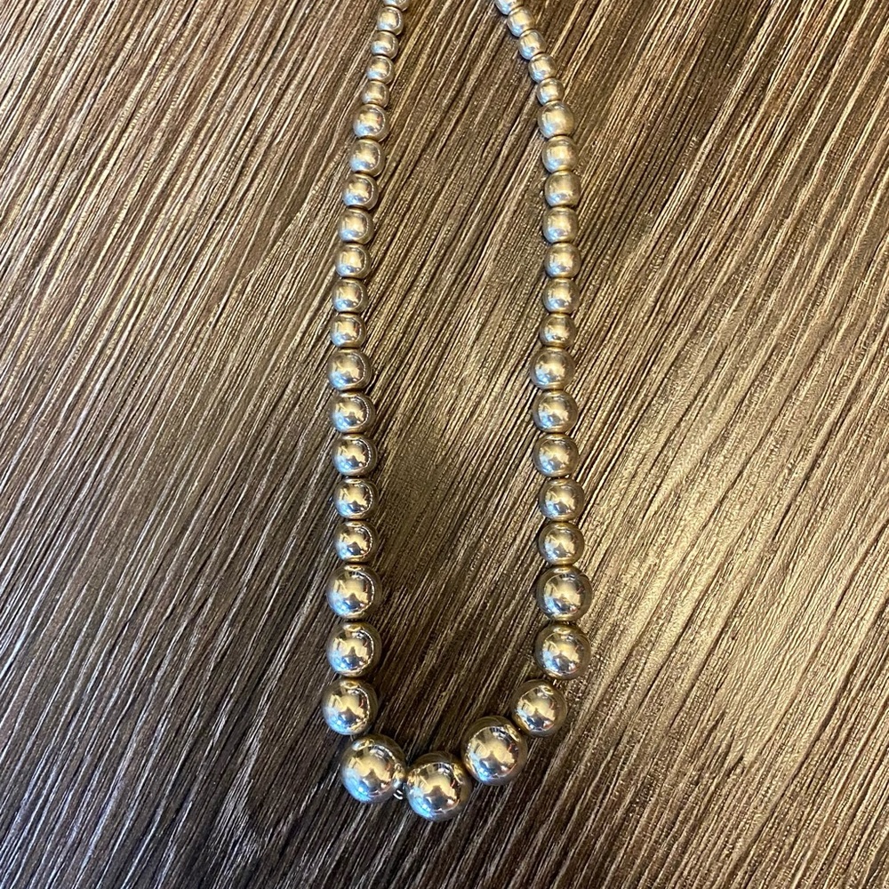Sterling silver graduated small ball necklace.